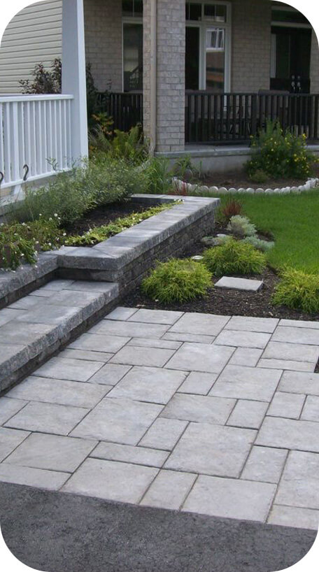 Stone patio landscaping with interlock steps
